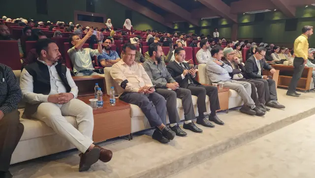 A full auditorium during a session