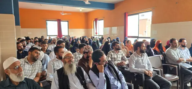 Members filling a district session hall